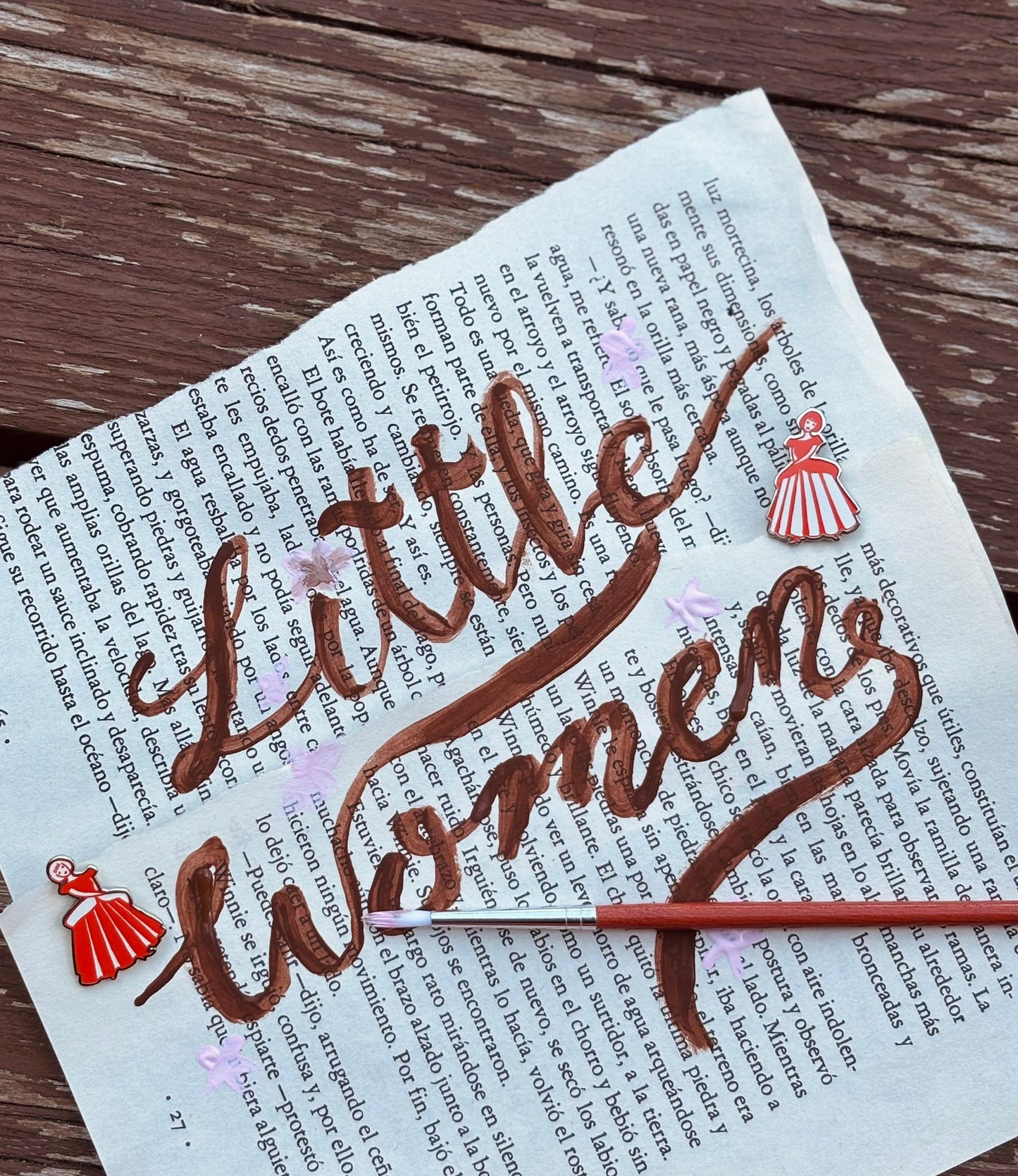Decorative text 'Little Women' on a book page with red accents.
