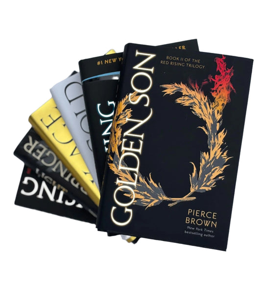 Stack of books with 'Colden Son' by Pierce Brown on a light gray background