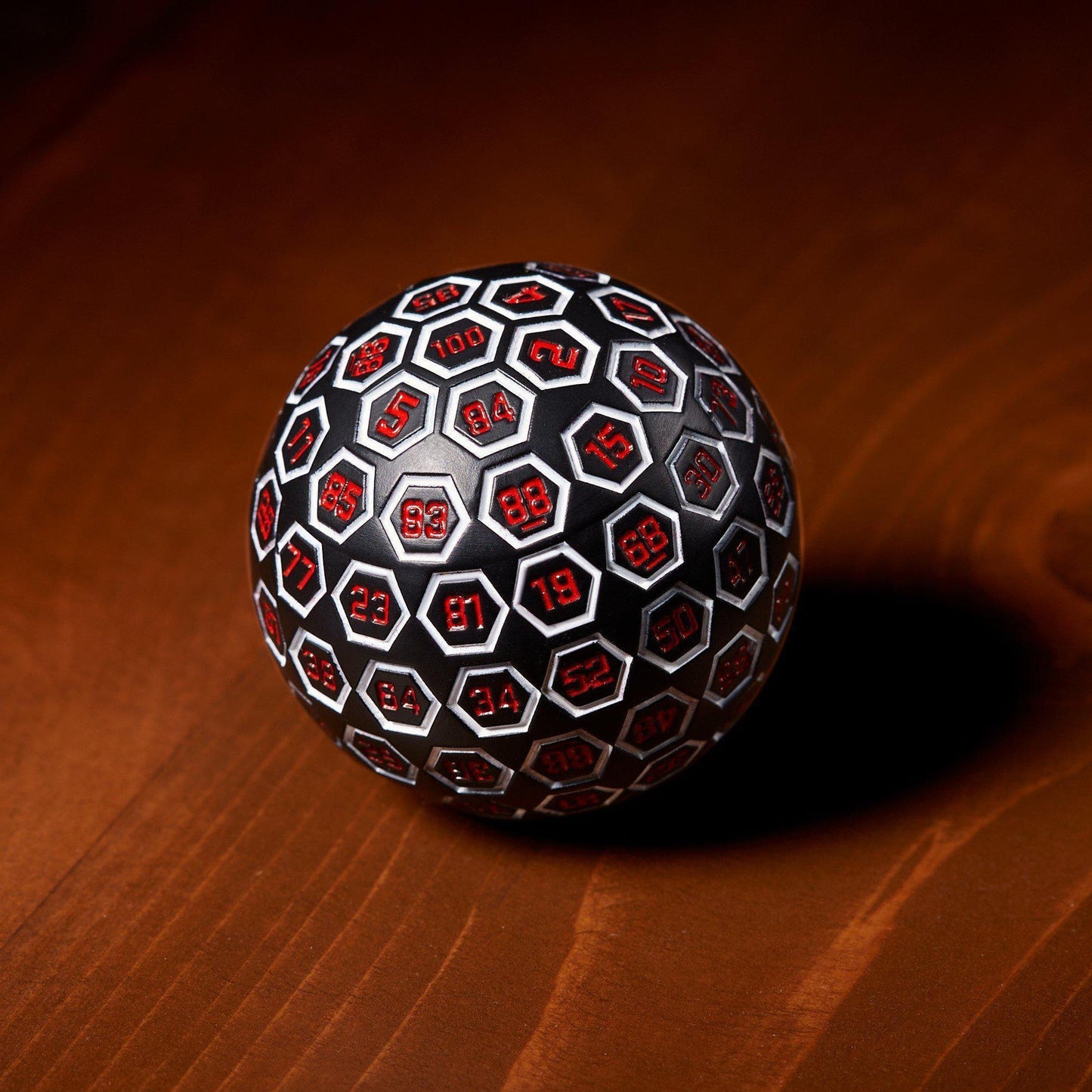 The Orb D100 - White, Red, and Black Metal Die