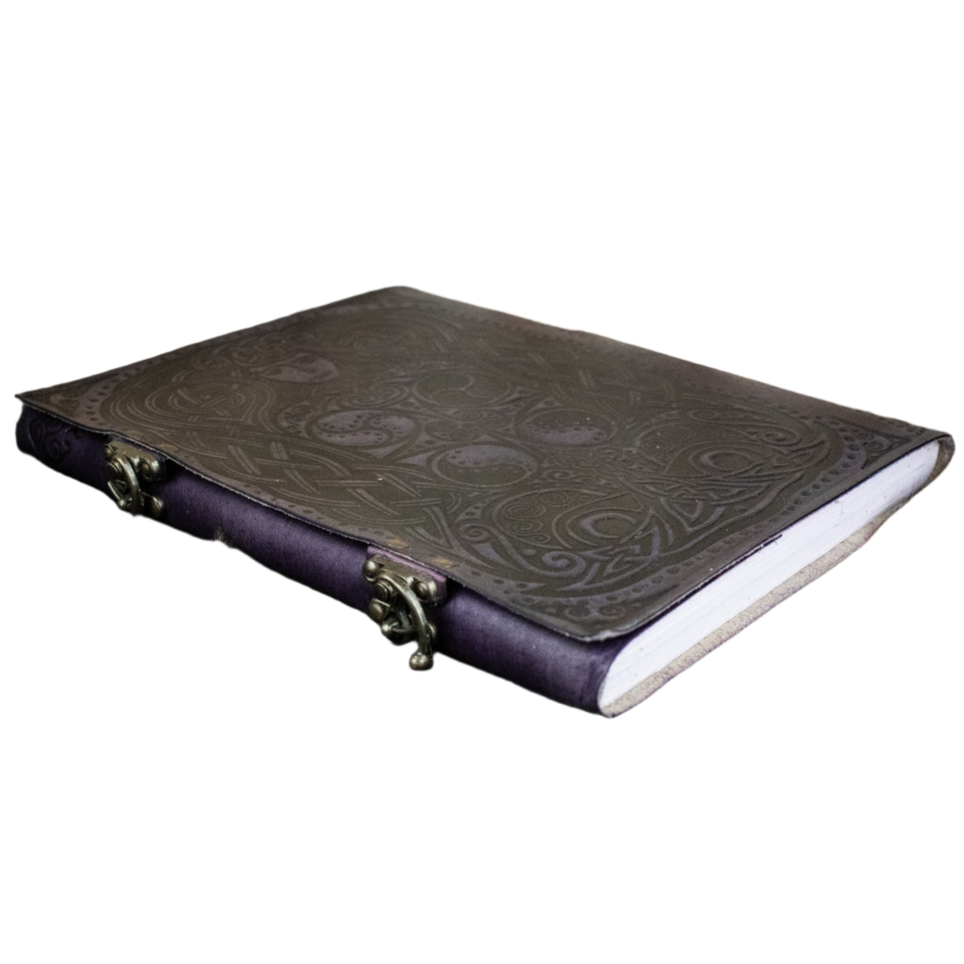 Leather-bound book with embossed design on a fur surface